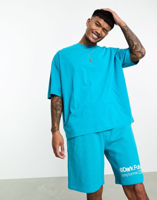 ASOS Dark Future Locker geschnittene Shorts in Blau mit Logoprint am Bein Kombiteil ASOS