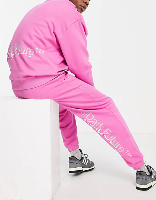 Men Future oversized joggers with back logo print in bright pink 