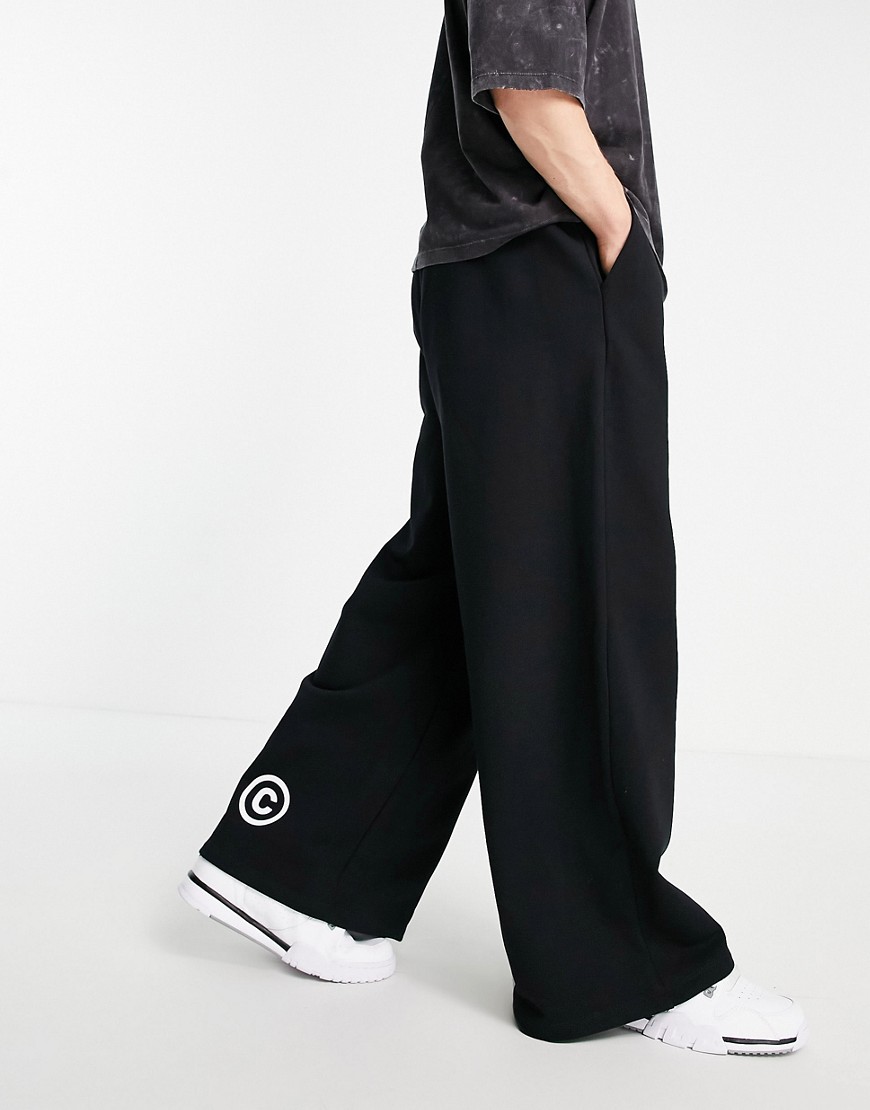 ASOS Dark Future - Oversized joggingbroek van zware stof met wijde pijpen en print in zwart