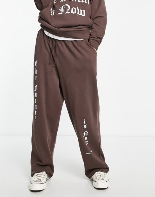 ASOS Dark Future oversized sweatpants in dark brown with gothic text print - part of a set 
