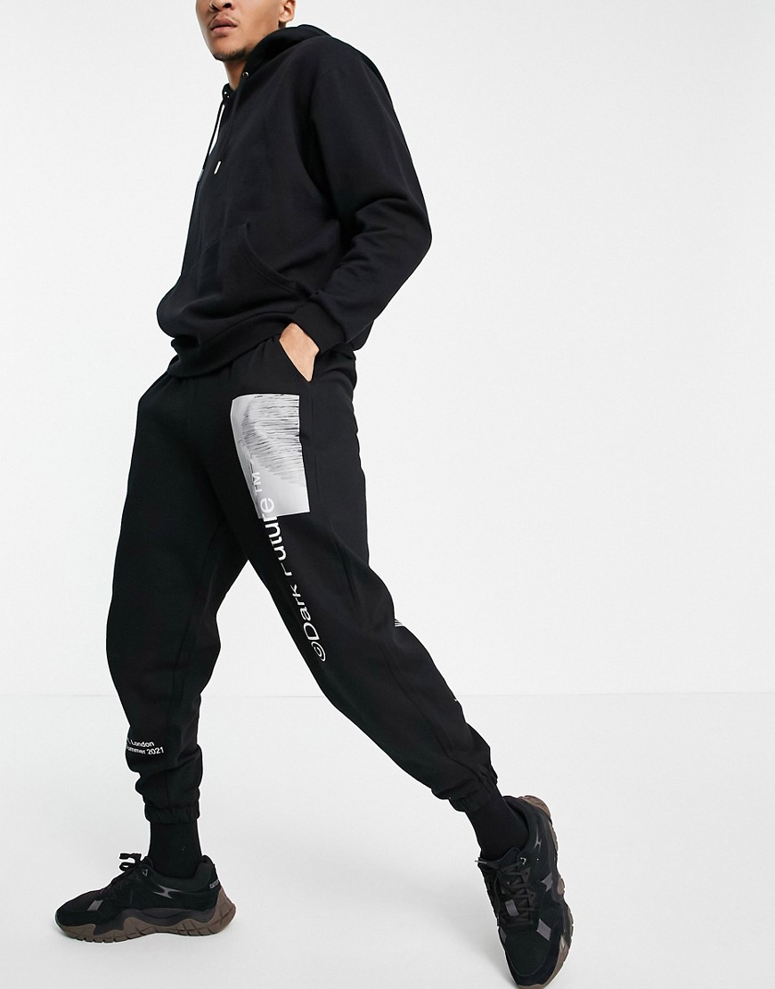 ASOS Dark Future oversized sweatpants with logo prints in black - part of a set
