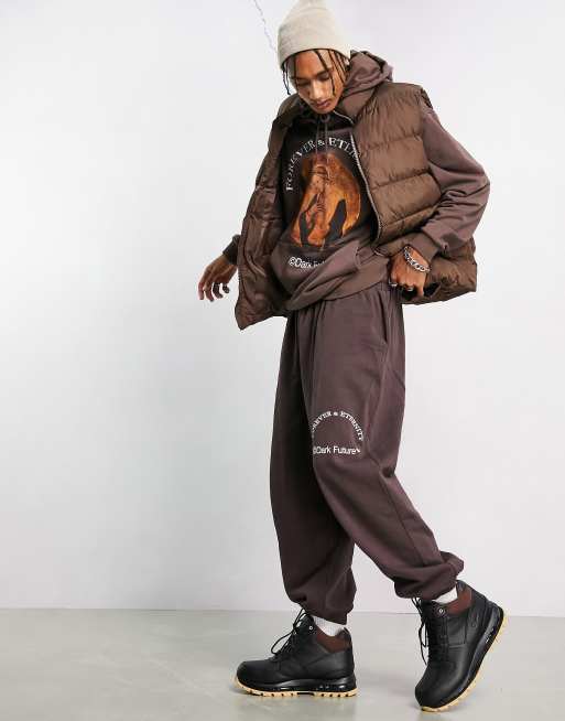ASOS Dark Future oversized sweatpants with slogan and logo print in brown - part of a set