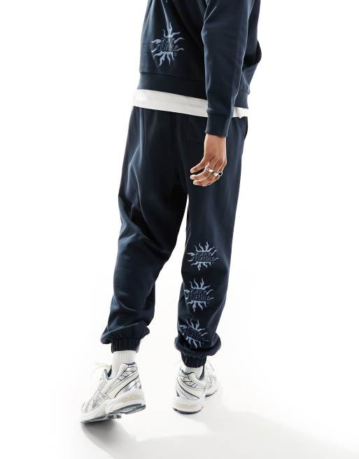 ASOS Dark Future oversized trackies in navy with leg print (part of a set)