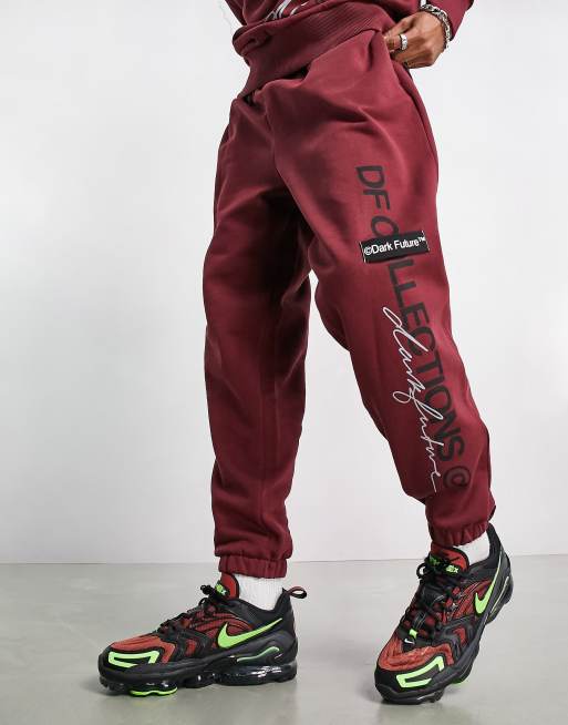 ASOS Dark Future oversized trackies with multiple logos in burgundy (part of a set)