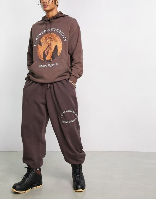 ASOS Dark Future oversized trackies with slogan and logo print in brown (part of a set), 3 of 4