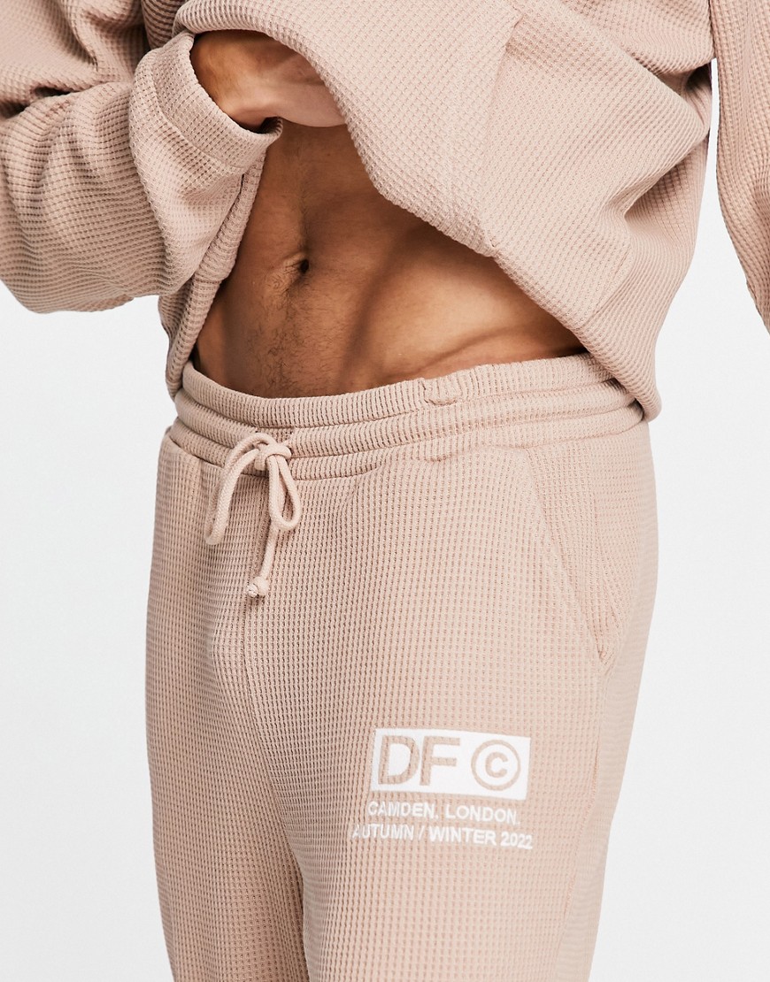 ASOS Dark Future relaxed fixed hem sweatpants in waffle texture with logo embroidery in neutral - part of a set