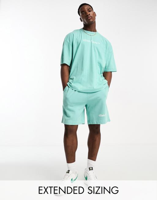 ASOS Dark Future relaxed shorts with logo print in washed green (Part of a set)