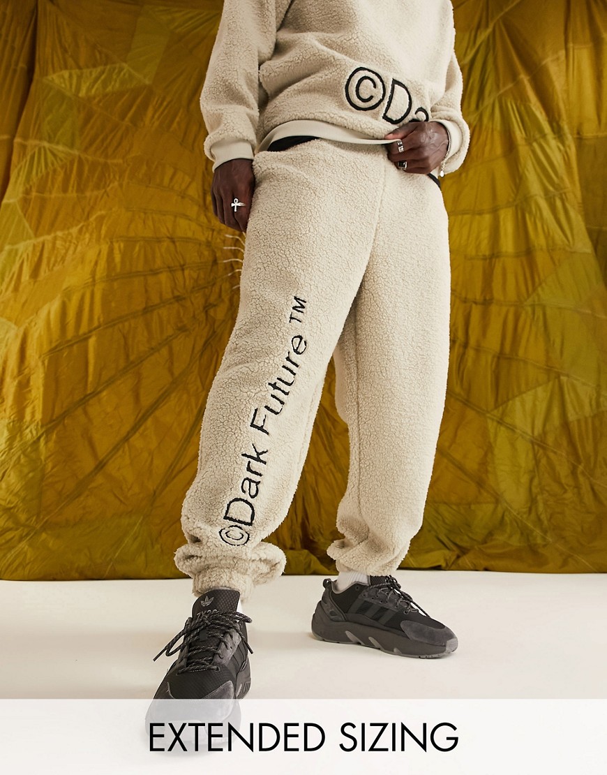 ASOS Dark Future relaxed sweatpants in teddy borg with leg logo embroidery in neutral - part of a set