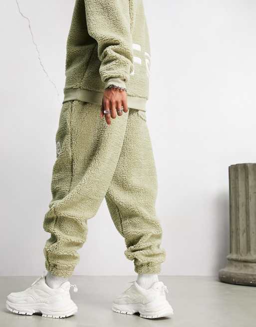 ASOS Dark Future relaxed sweatpants in teddy fleece with logo