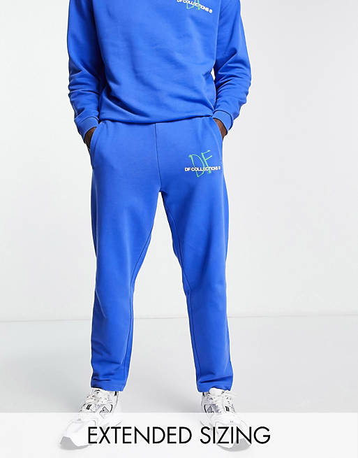 ASOS Dark Future relaxed sweatpants with logo graphic print in blue - part of a set