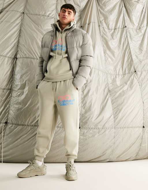 ASOS Dark Future relaxed trackies with logo graphic print in neutral (part of a set)