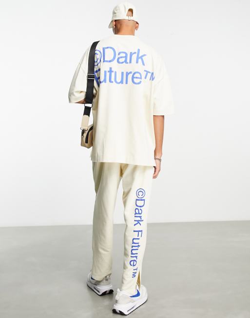 ASOS Dark Future relaxed trackies with side splits and logo puff prints in off white (part of a set)