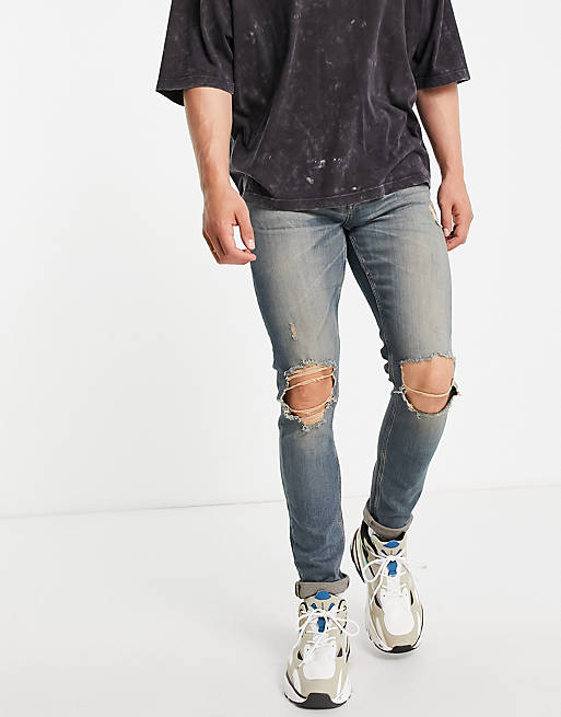 ASOS Dark Future skinny jeans in tinted wash with knee rips