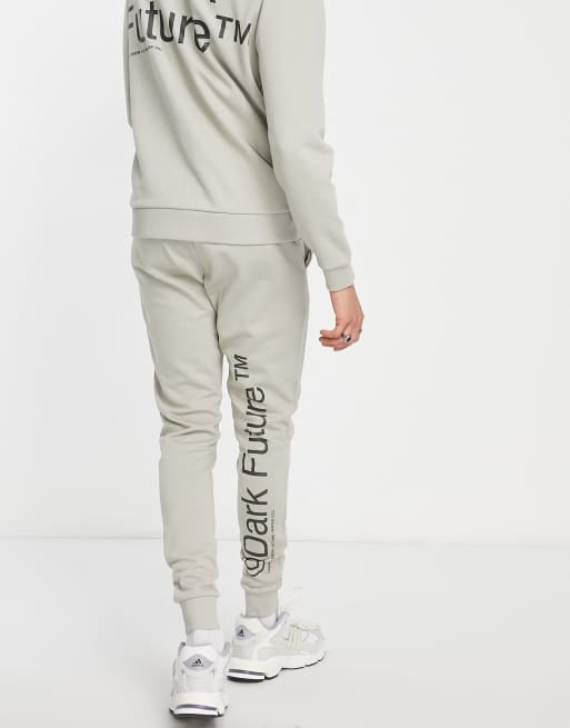 ASOS Dark Future skinny trackies with logo print in neutral (part of a set)