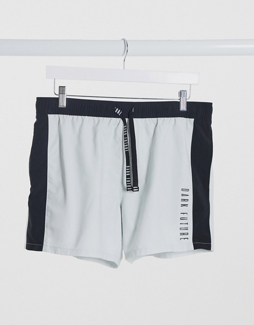 ASOS Dark Future swim shorts with cut and sew design in white