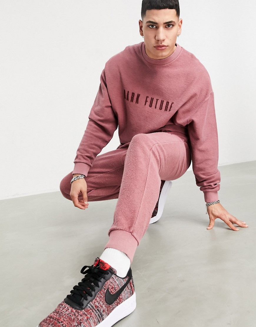 ASOS Dark Future tracksuit in reverse wash with embroidered logo in pink