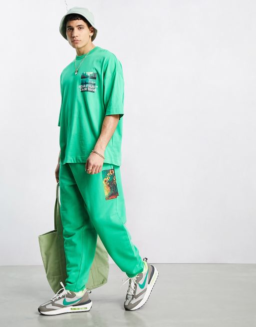 ASOS Dark Future x Claude Monet relaxed trackies with multi placement graphic prints in green (part of a set)