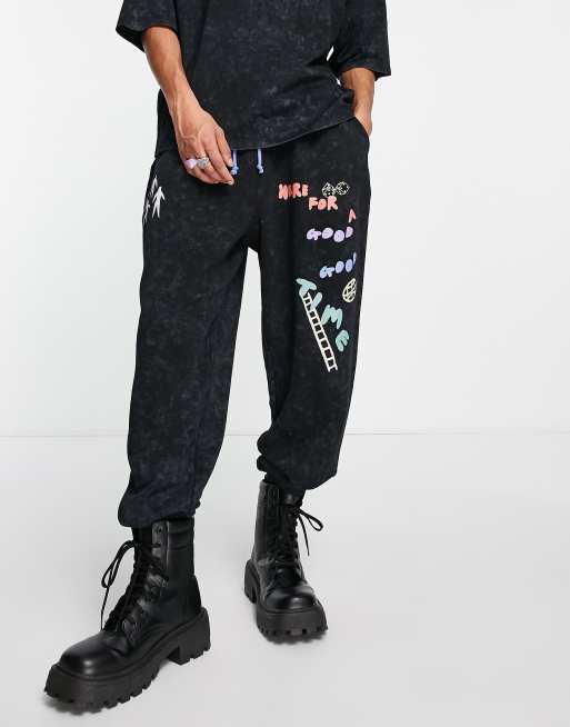 ASOS Daysocial co-ord oversized joggers with multi game graphic prints and logo in washed black