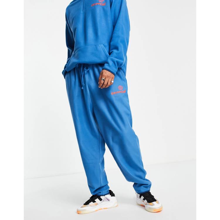 ASOS Daysocial co-ord relaxed joggers in polar fleece with logo print in  blue