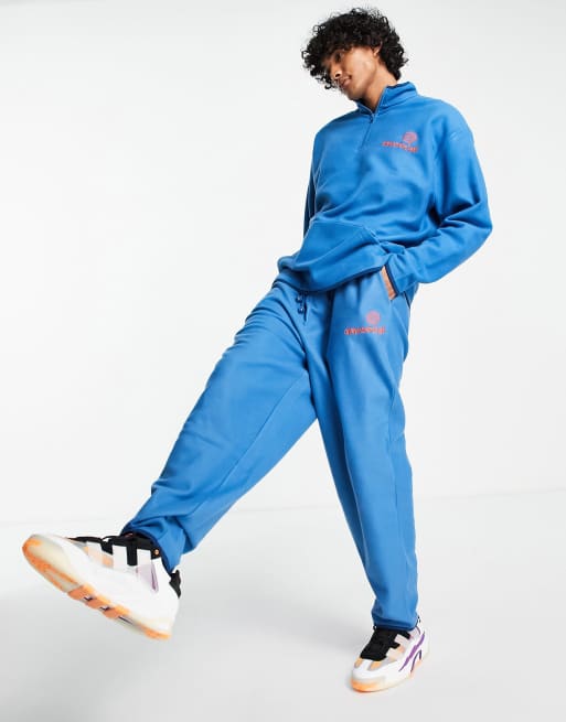 ASOS Daysocial co-ord relaxed joggers in polar fleece with logo print in  blue