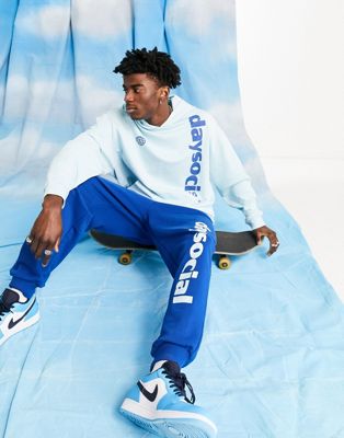 ASOS Daysocial co-ord relaxed joggers with vertical logo print in blue