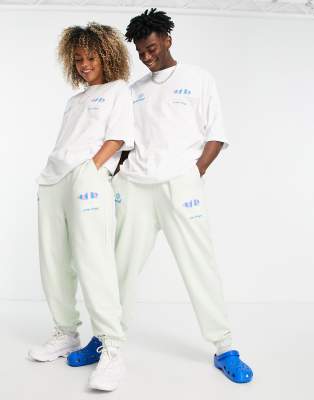 ASOS Daysocial unisex co-ord relaxed joggers with surf graphic prints in light green - ASOS Price Checker