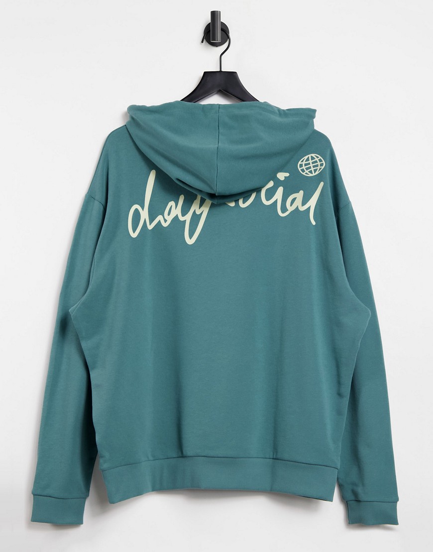 ASOS Daysocial - Oversized hoodie met logoprint op de achterkant in groen met wassing