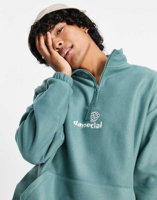 ASOS Daysocial oversized quarter zip sweatshirt in polar fleece with logo  print in teal