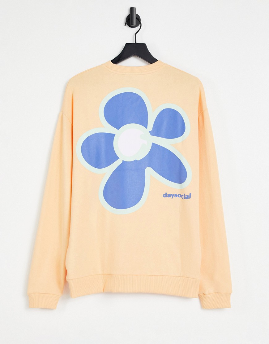 ASOS Daysocial oversized sweatshirt with front and back flower and logo prints in peach-Orange