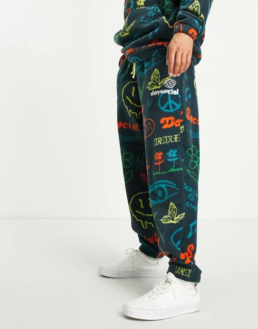 ASOS Daysocial oversized trackies in all over print polar fleece in navy (part of a set)