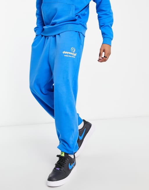 ASOS Daysocial oversized trackies with logo print in bright blue (part of a set)