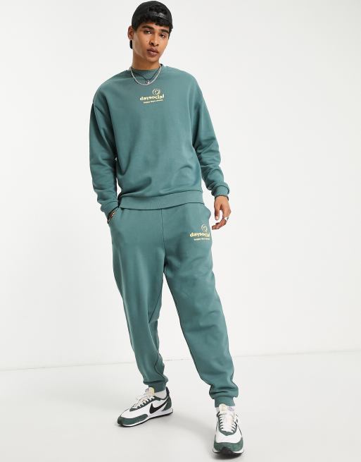 ASOS Daysocial oversized trackies with logo print in teal blue (part of a set)