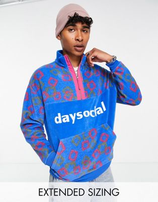 ASOS Daysocial quarter zip sweatshirt in fleece with all over logo print in blue