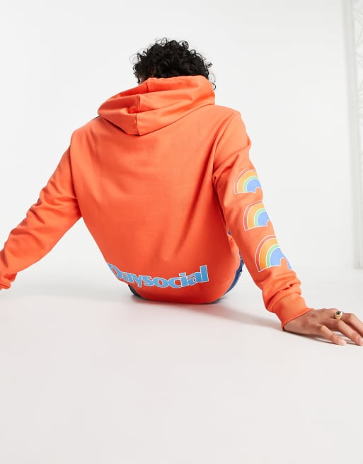 ASOS Daysocial relaxed hoodie with multi placement logo prints in orange