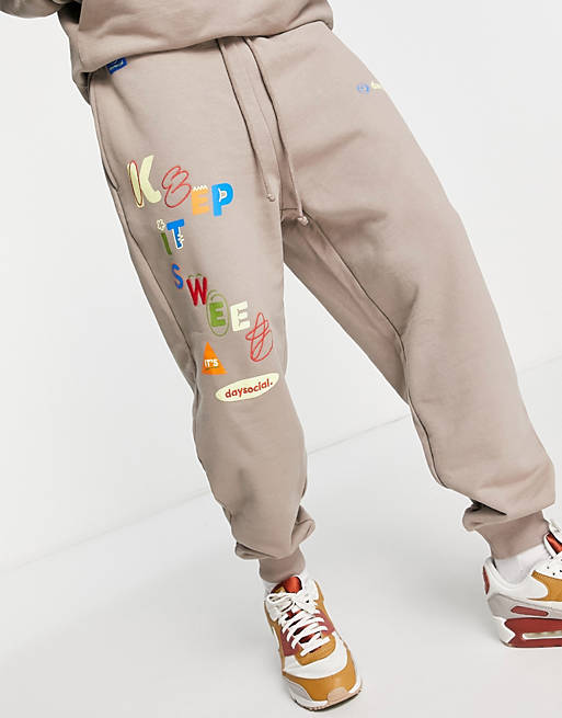 part of a set Asos Men Sport & Swimwear Sportswear Sports Pants ASOS Daysocial relaxed sweatpants with graphic and logo print in 