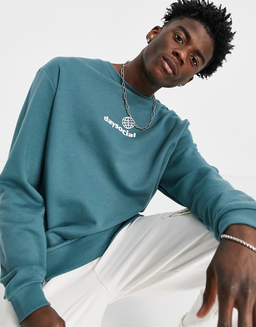 ASOS Daysocial relaxed sweatshirt in blue with white small front logo print-Blues