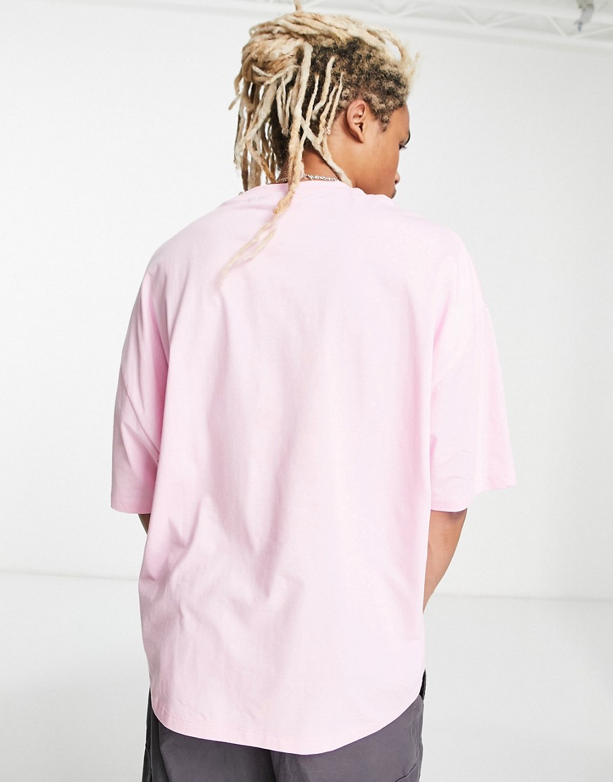 T-shirt oversize unisex rosa con stampa grafica di logo sul petto - ASOS DESIGN T-shirt donna  - immagine3