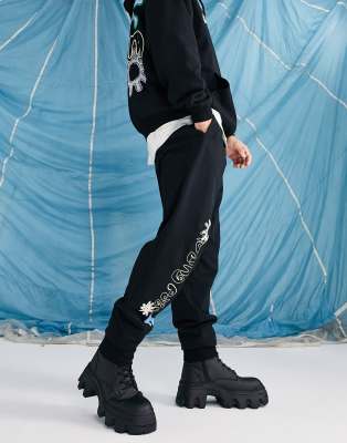ASOS Daysocial unisex co-ord relaxed joggers with logo and graphic prints in black - ASOS Price Checker