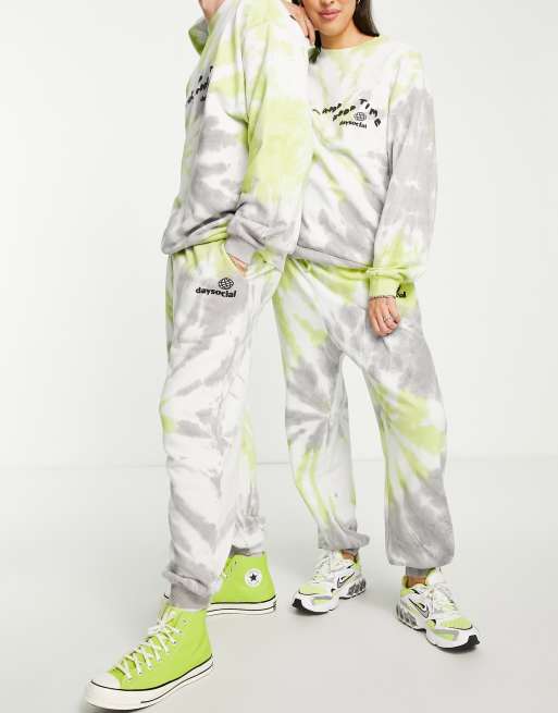 ASOS Daysocial unisex co-ord relaxed joggers with slogan print in tie dye green