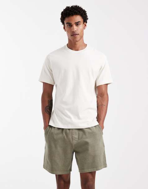 ASOS DEISGN oversized jersey shorts with back pocket in dark green - view 1