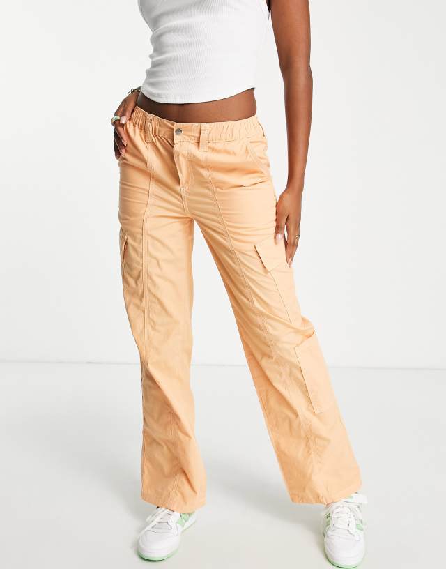 ASOS DESIGN 00s low rise cargo pants in orange