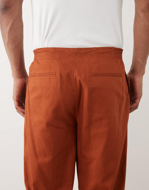 ASOS DESIGN 100% cotton linen look oversized tapered suit pants with elasticized waist in burnt orange, 4 of 5