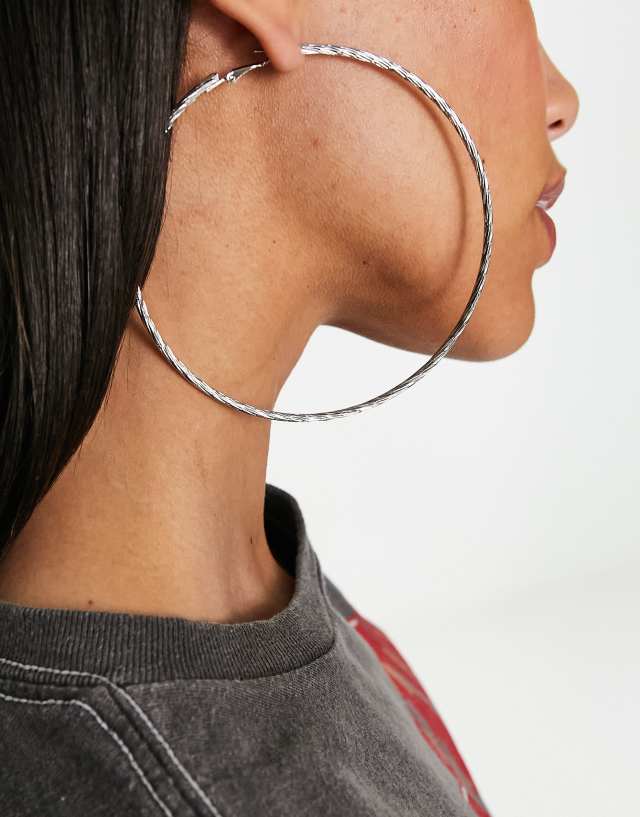 ASOS DESIGN 100mm hoop earrings with multi twist design in silver tone