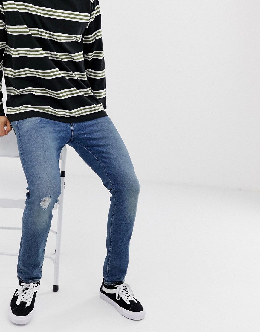 ASOS DESIGN – 12 oz – Mellanblå skinny jeans med slitna partier