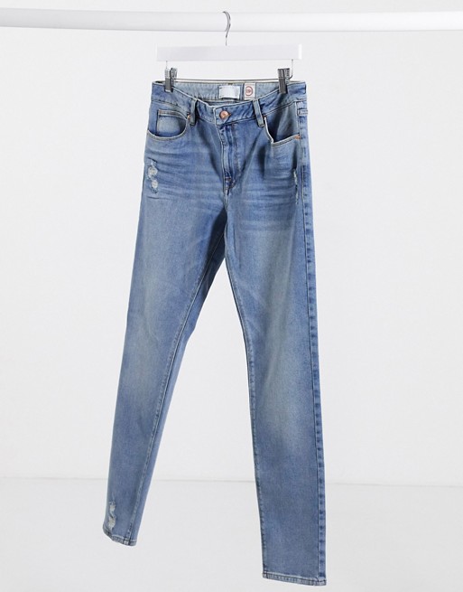 ASOS DESIGN 12.5oz skinny jeans in mid wash blue with abrasions