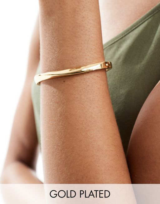  ASOS DESIGN 14k gold plated bangle bracelet with minimal twist design
