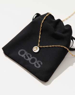 ASOS DESIGN ASOS DESIGN 14k gold plated necklace with Taurus zodiac and faux pearl disk design with gift bag