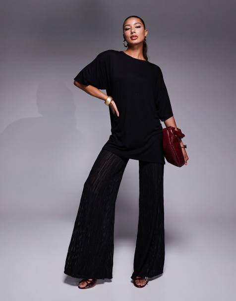 ASOS DESIGN 2 in 1 oversized t-shirt jumpsuit with metallic plisse pants in black - view 1