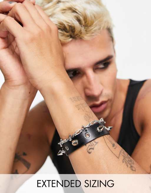 ASOS DESIGN 2 pack bracelet with cross chain and and spiked pu in silver tone