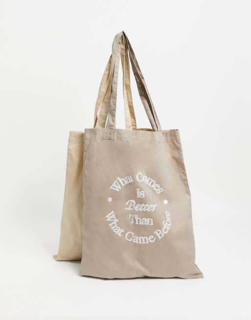 ASOS DESIGN 2 pack of tote bags in neutral tones with positive message